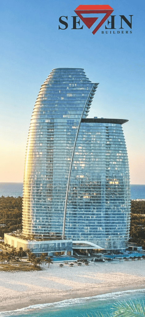 Curved glass skyscraper with Seven Builders logo by the beach at sunset in Negril, Jamaica.